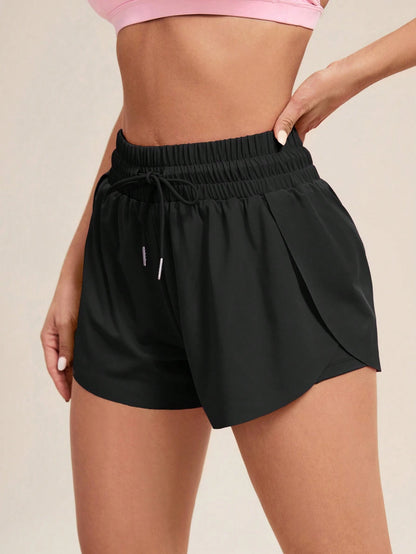 Lockere Sport-Shorts mit Taschen und Bindeband